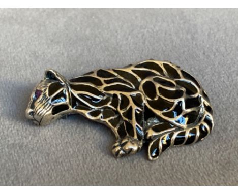 A silver plique a jour cat brooch with ruby eyes, weighing in at 7.91grams 