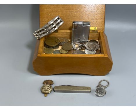 Wooden musical box containing coins and Ronson lighter 