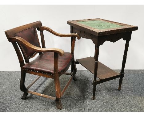 Aan Arts and Crafts upholstered oak armchair together with a tile topped two tier oak side table, table 73 x 61 x 45cm.