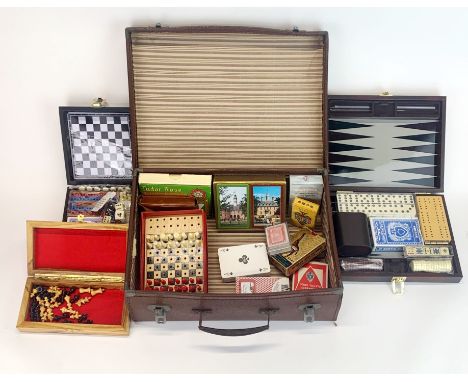 A quantity of vintage playing cards and games.