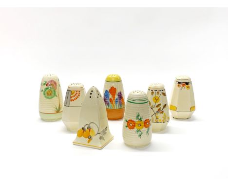 A group of Clarice Cliff, Crown Devon and other Art Deco sugar shakers, H. 12cm.