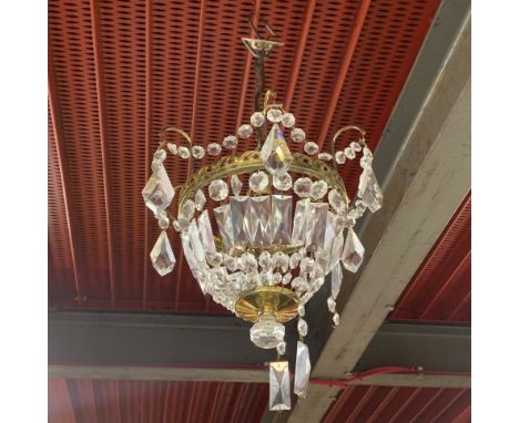 A pair of gilt brass and crystal light fittings, Dia. 26cm, H. 26cm.