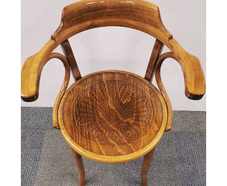 A vintage bentwood chair with impressed decoration to seat, H. 83cm.