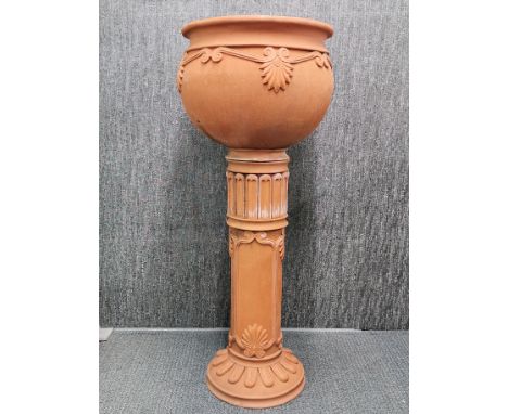 A vintage terracotta garden planter on pedestal handmade by Vanessa Lewis including a picture of maker and planter in the 198