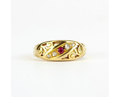 An antique Victorian 18ct yellow gold ring set with a ruby and diamonds, (M).