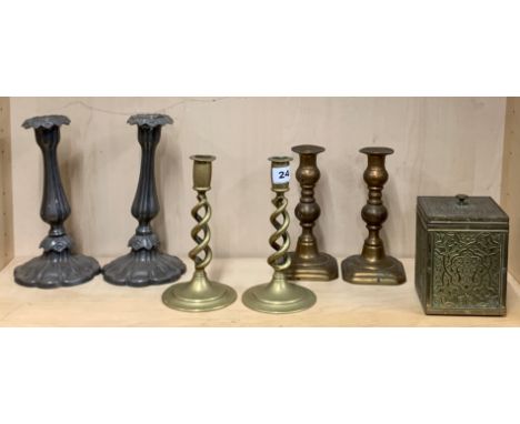 Two pairs of 19th century brass candlesticks, with a pair of spelter candlesticks and a brass covered tea caddy, tallest H. 2