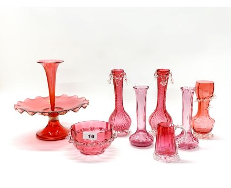 A 19th century ruby glass centrepiece, with a group of 19th century cranberry glass items, centrepiece H. 25cm.