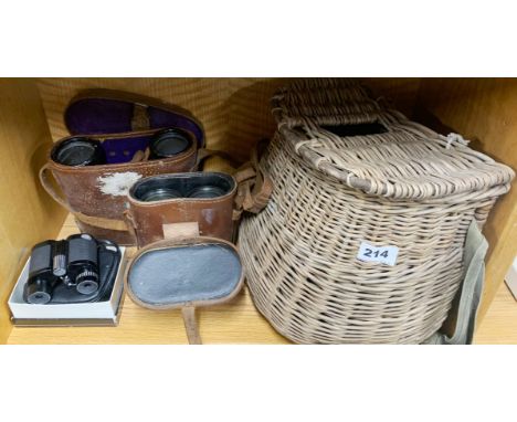 Two pairs of vintage binoculars (one Omega) together with a pair of Nikon binoculars and a fishing basket.