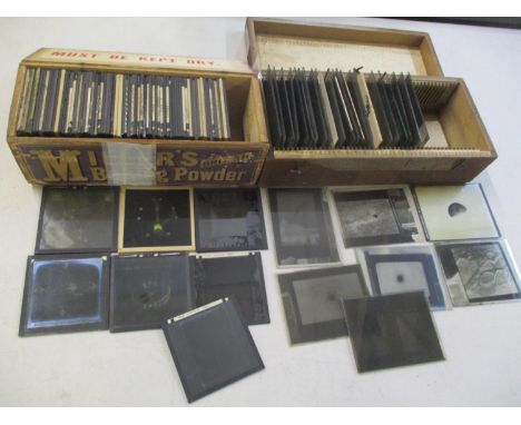 Box of early 20th century magic lantern slides and glass plates relating to astronomy with a box of glass negatives with the 