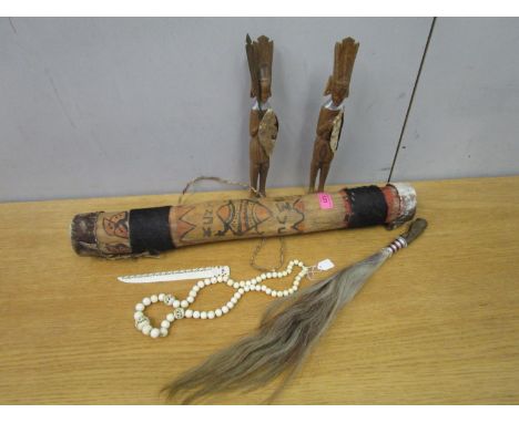 Ethnic related items to include a Kenyan fly swat and two carved wooden figures, a painted wooden arrow quill, early 20th cen