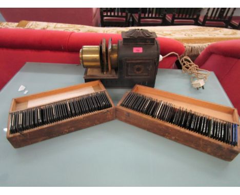 A magic lantern with two boxes of glass slides, some depicting views of Glamis Castle 