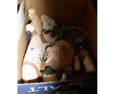 A box containing a quantity of ceramic, resin and other sheep models
