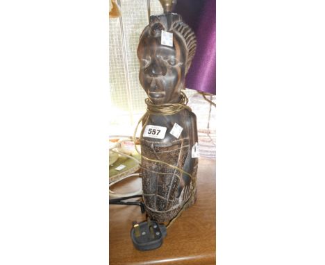 A large African hardwood lamp carved as a lady with child in papoose