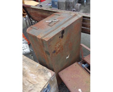 An old tin trunk of military style with remains of original green painted finish