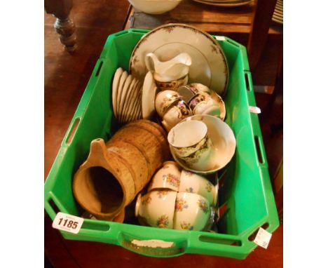 A crate containing a quantity of ceramic items including part tea sets, etc.