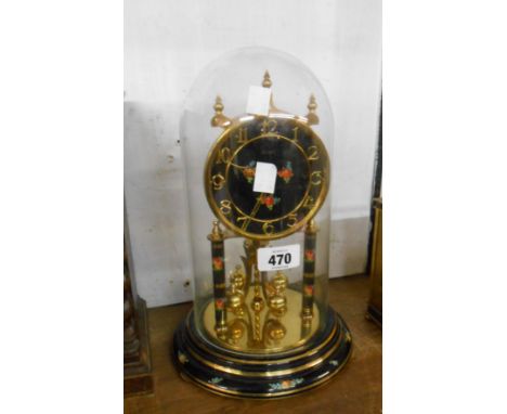 A vintage Kundo anniversary clock with floral and black lacquered decoration, ball pendulum and under glass dome