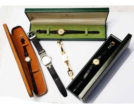 A boxed Gucci lady's goldtone cased wristwatch and two other boxed lady's wristwatches, a loose Gucci goldtone cased dress wa