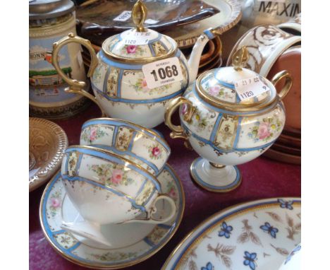 An early 20th Century Noritake part coffee set of pedestal form comprising coffee pot, sucrier and two cups and saucers