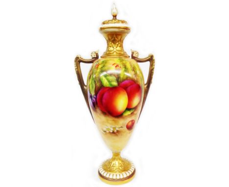 A large Royal Worcester two handled lidded vase of baluster form with hand painted fruit decoration depicting peaches and che