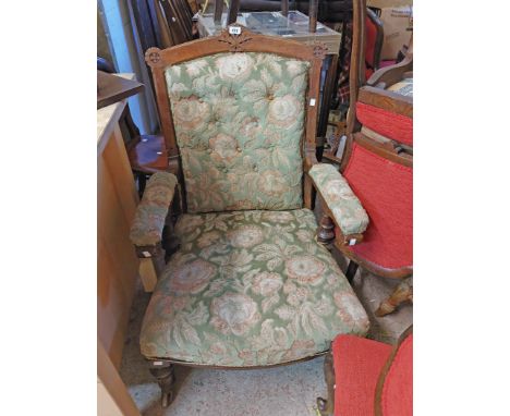 An Edwardian stained oak part show frame drawing room armchair with button back floral tapestry upholstery, set on turned fro