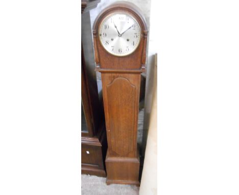 A vintage oak cased granddaughter clock with Arabic numerals and HAC eight day chiming movement - associated pendulum