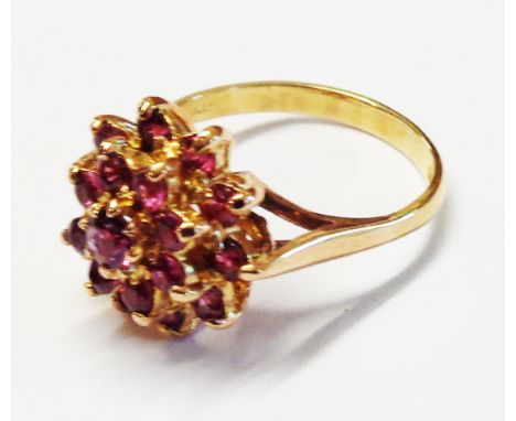 A 9ct. rose gold ring, set with pink ruby cluster - size L 1/2