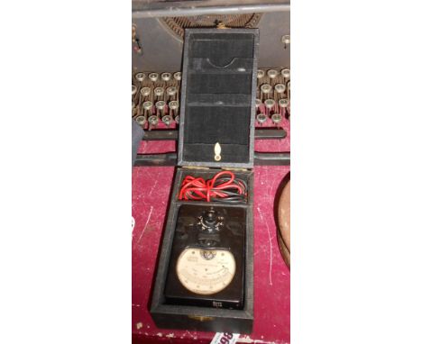A cased Ferranti Bakelite volt and milliamperes meter with W.D. arrow mark to dial