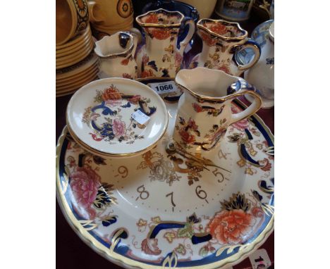 A selection of Masons Ironstone items decorated in the Mandalay pattern comprising wall clock, jugs, plate and dishes
