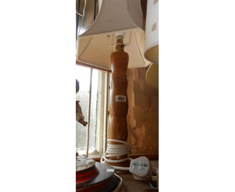 A tall turned wood table lamp