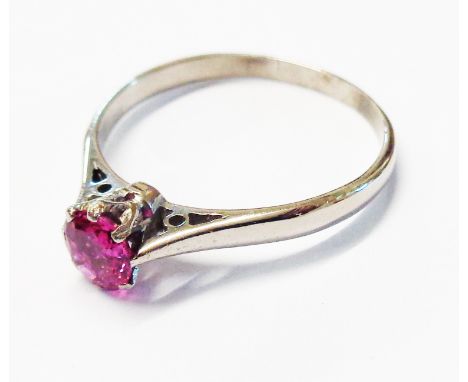 A marked 18ct white metal ruby solitaire ring - size S