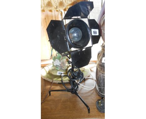 A modern desk lamp in the form of a theatre spotlight