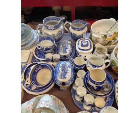 A quantity of blue and white china of various makers including Copeland Spode and Burleigh including jugs, teapot, egg cups, 