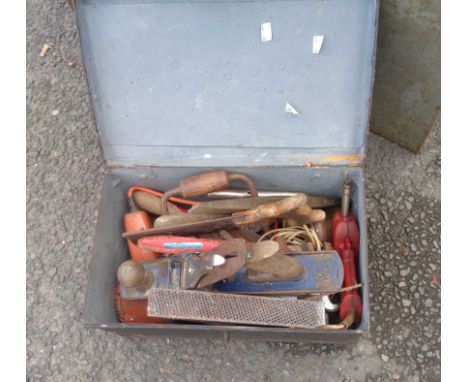 An old black japanned lift-top box containing a quantity of woodworking tools