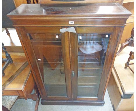 A 94cm 1930's stained mixed wood display cabinet with plate shelves and hooks enclosed by a pair of glazed panel doors, set o