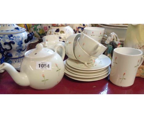 A small selection of Dartmouth pottery teaware comprising teapot, two large and three smaller cups and saucers, milk jug and 