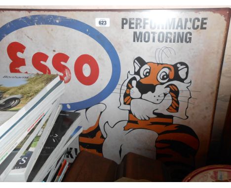 A modern printed tin Esso tiger advertising sign