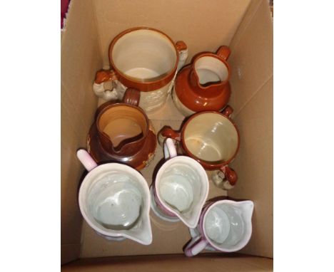A box containing a selection of ceramic items comprising a Royal Doulton salt glazed stoneware harvest jug (restored spout), 
