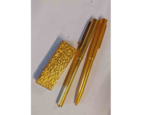 Alfred Dunhill: a vintage gold plated Rollalite lighter - sold with a similar ballpoint pen and a fibre tip pen