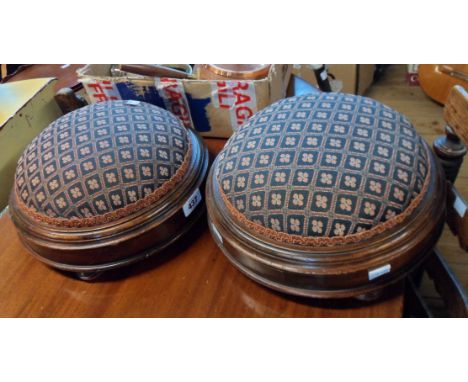 A pair of late Victorian mahogany circular foot stools with later tapestry upholstery