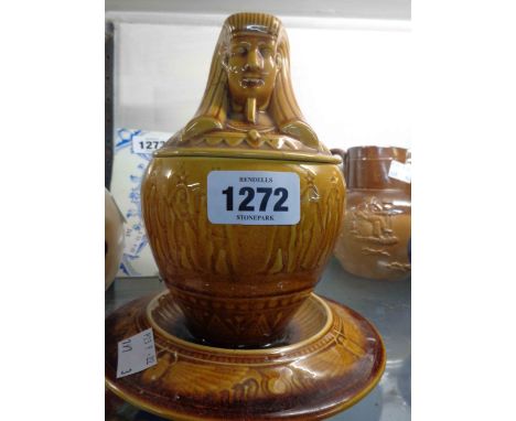 A 19th Century Linthorpe art pottery lidded jar modelled in the form of an Egyptian canopic jar with integral stand (Model No