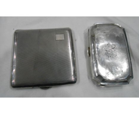 Two silver cigarette cases comprising one with engine turned decoration and blank cartouche (catch spring soft)and silver cas