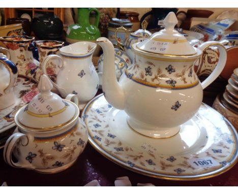 A Royal Grafton bone china part tea set decorated in the butterfly design by the David Linley Co. for Mappin &amp; Webb compr