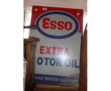 A large modern printed tin Esso Extra Motor Oil sign