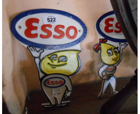 A pair of modern painted cast iron Esso signs in the form of a boy and girl