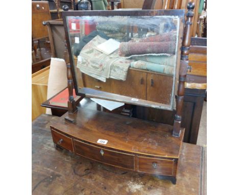 A 19th Century mahogany and strung platform dressing table mirror with oblong plate, set on a bow front base with three drawe