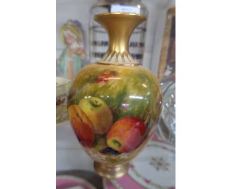 A small Royal Worcester porcelain vase of baluster form with hand painted fruit decoration depicting apples and cherries to f