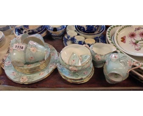 An Aynsley bone china part tea set comprising five trios, milk and sugar, two bread and butter plates and spares decorated wi