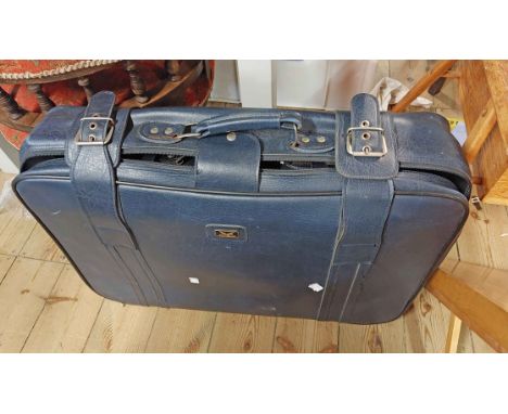 A set of three graduated suitcases containing a quantity of electrical items including personal CD player, Kindle Fire, etc.