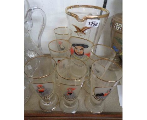 A vintage glass lemonade set comprising jug and six tall glasses, the jug decorated with a hand painted portrait depicting He
