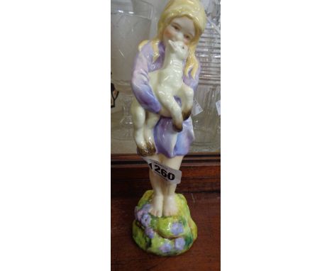 A Royal Worcester figurine 'Spring' modelled by Freda Doughty depicting a young girl holding a lamb, painted in naturalistic 